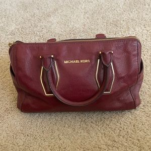 Michael Kors leather burgundy purse.